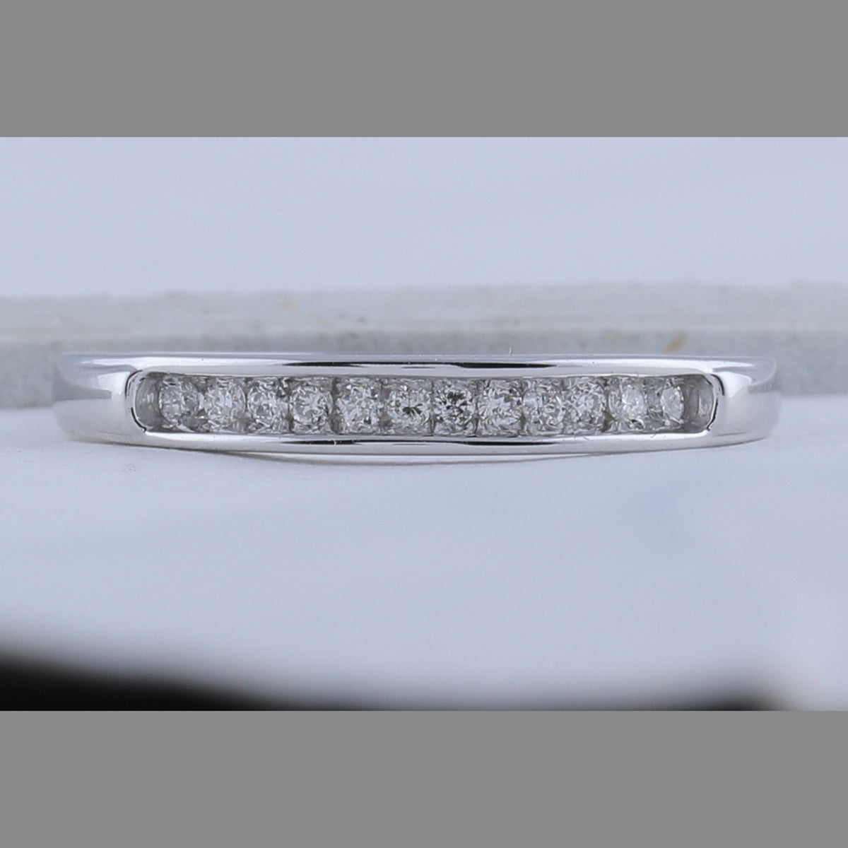 Radiant Reflections | 10kt White Gold Women's Round Diamond Single Row Band Ring 1/8 Cttw - Splendid Jewellery