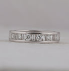 Captivating Symphony: 14kt White Gold Womens Alternating Round Baguette Diamond Single Row Wedding Band 1 Cttw Front View from Splendid Jewellery