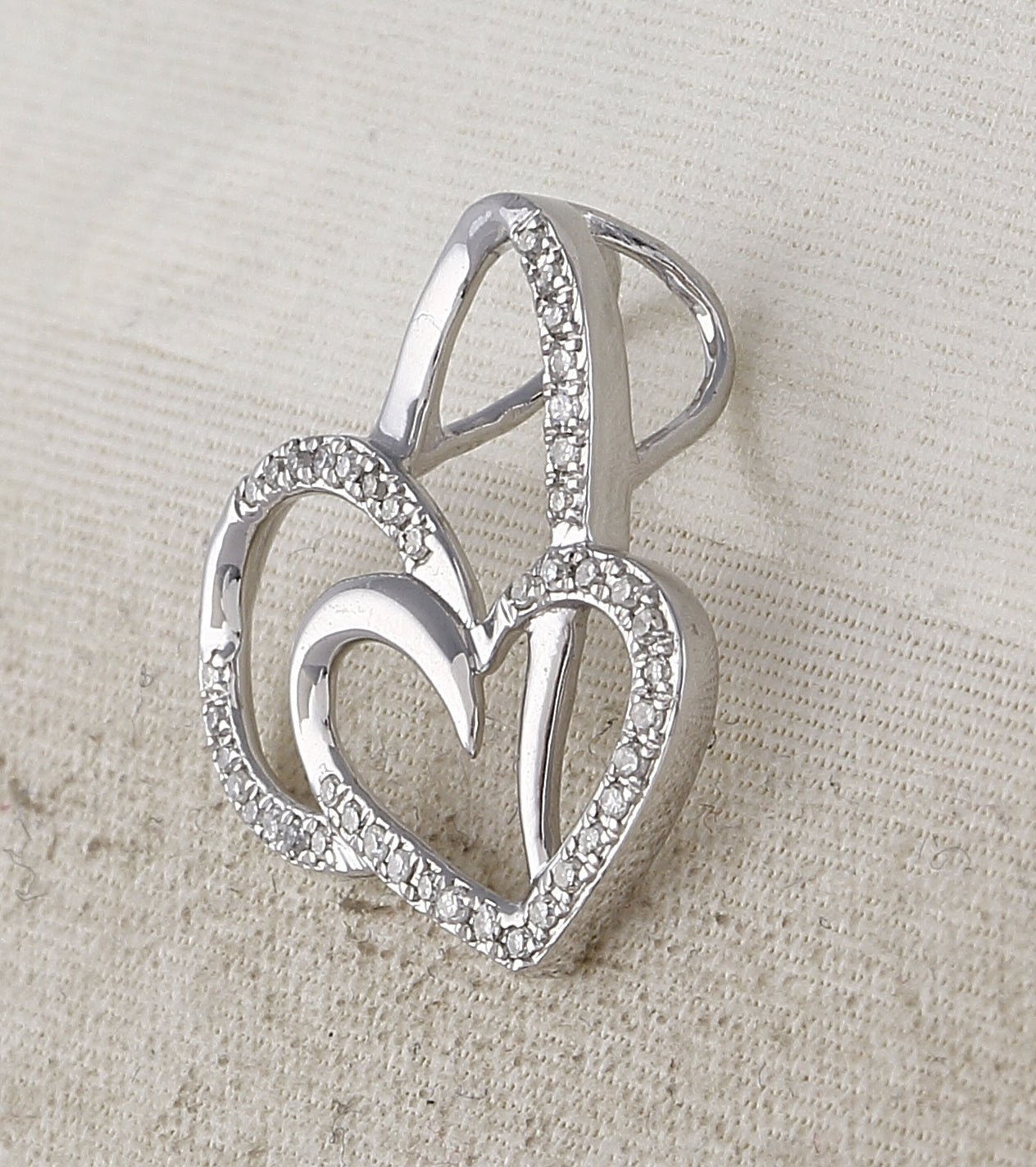 Enchanting Love's Eternal Embrace Pendant | 10kt White Gold Womens Round Diamond Heart Pendant 1/6 Cttw - Splendid Jewellery