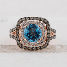 Load image into Gallery viewer, Radiant Blue Topaz Halo Ring in 14kt Rose Gold with Brown Diamonds - Front View
