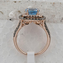 Load image into Gallery viewer, Radiant Blue Topaz Halo Ring in 14kt Rose Gold with Brown Diamonds - Side View