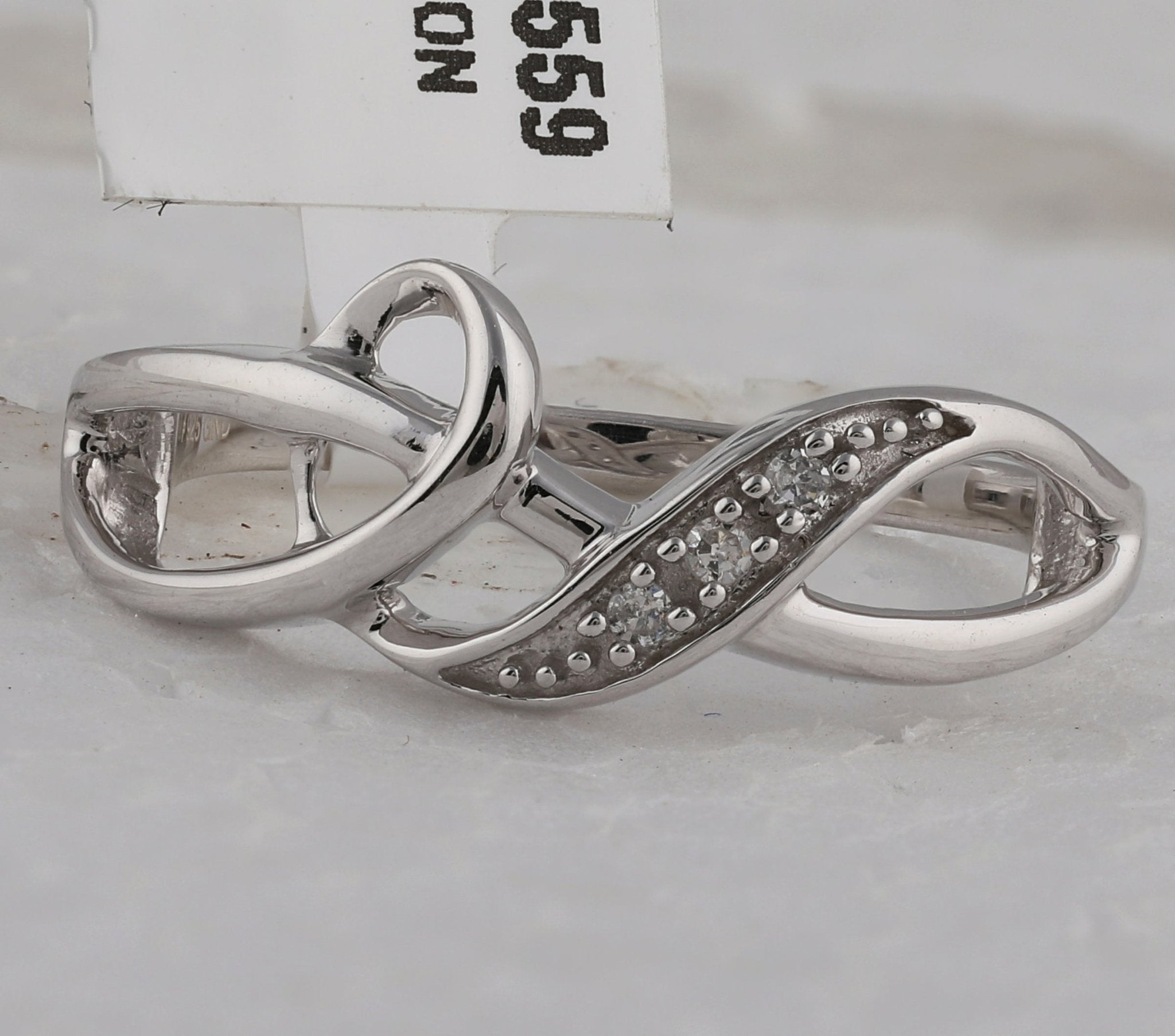 Sterling Silver Round Diamond Twist Fashion Band Ring . 0.03 Cttw - Splendid Jewellery