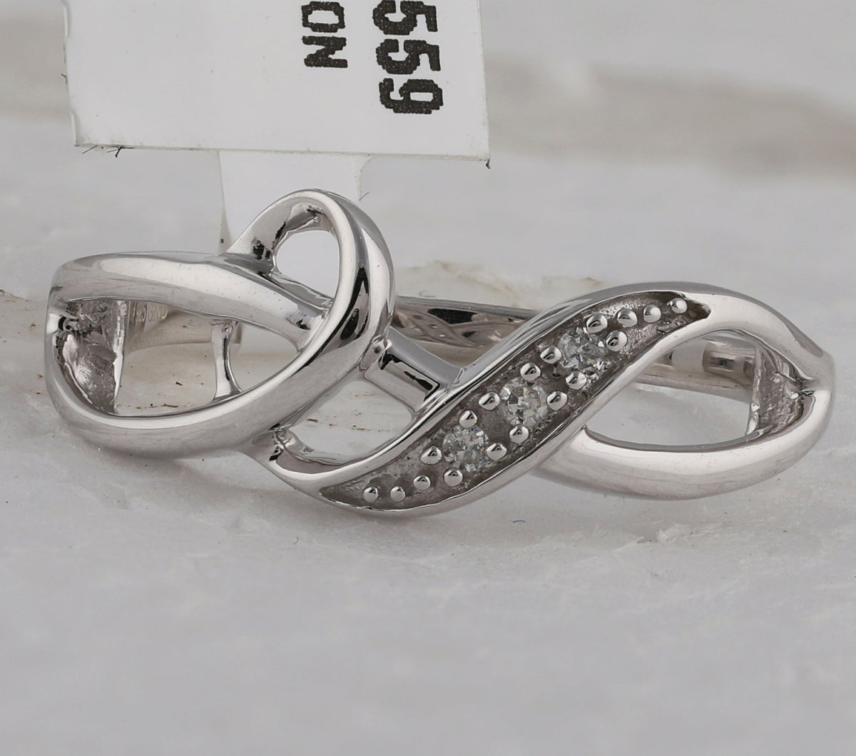 Sterling Silver Round Diamond Twist Fashion Band Ring . 0.03 Cttw - Splendid Jewellery